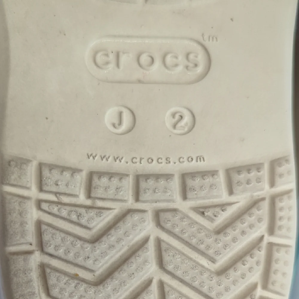 CROCS Kids Classic Clog in Cream with Light Blue Trim